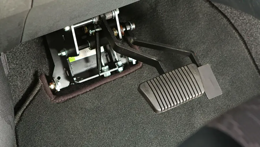 Instructor-side gas and brake pedal control